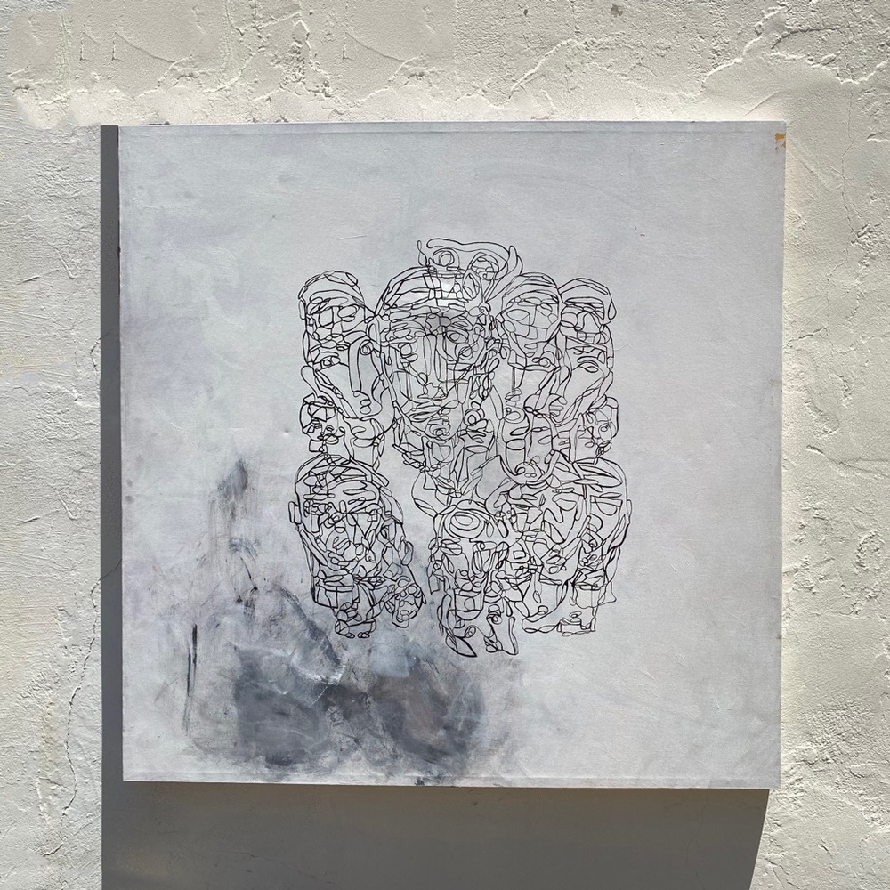 White bg w black line work collage face painting.